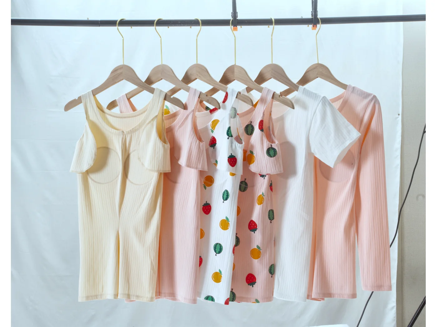 Camisoles with sewn-in cup padding in solid and printed colourways