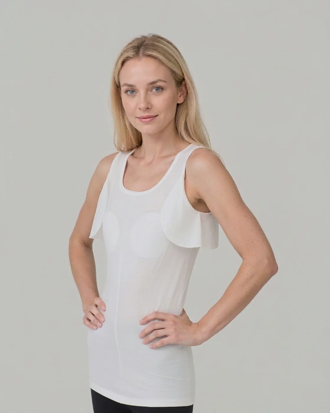 SS-01 knit liner with axilla flaps, white, worn by a woman, three-quarter view
