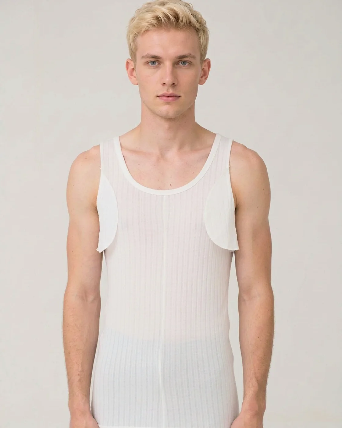 SS-01 knit liner with axilla flaps, white, worn by a man, front view